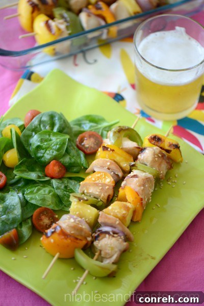 Pineapple Teriyaki Chicken Skewers, glazed with sweet and savory sauce, perfect for grilling.