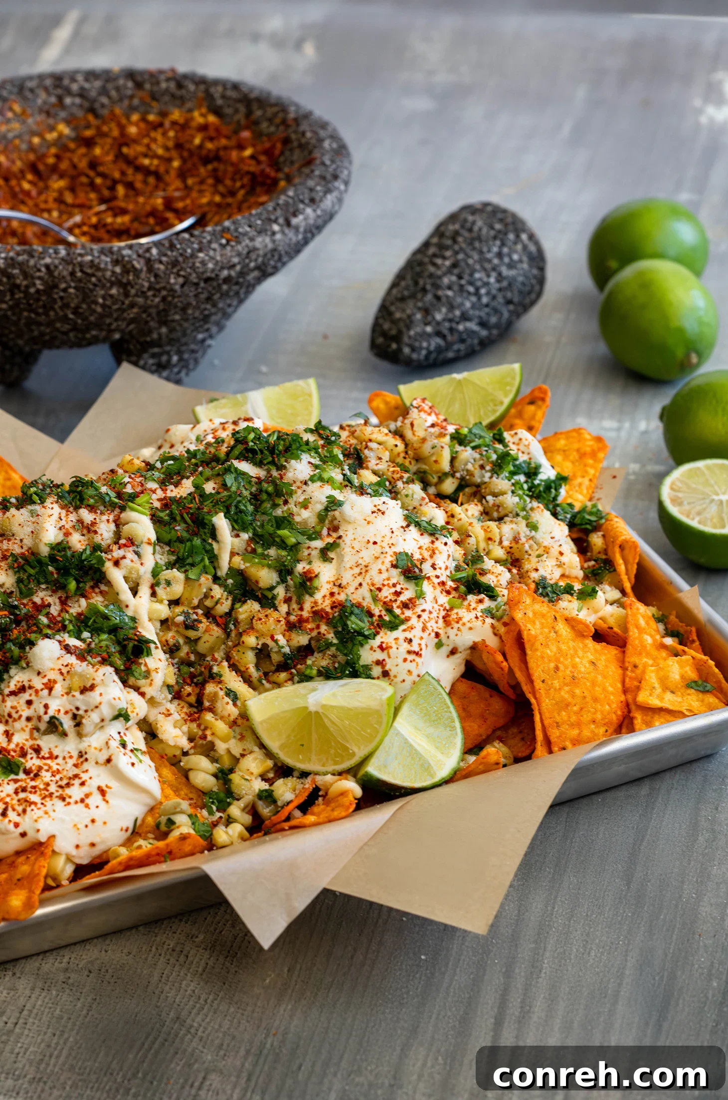 A vibrant bowl of Dori-Esquite, showcasing the various toppings and the rich colors of the ingredients.