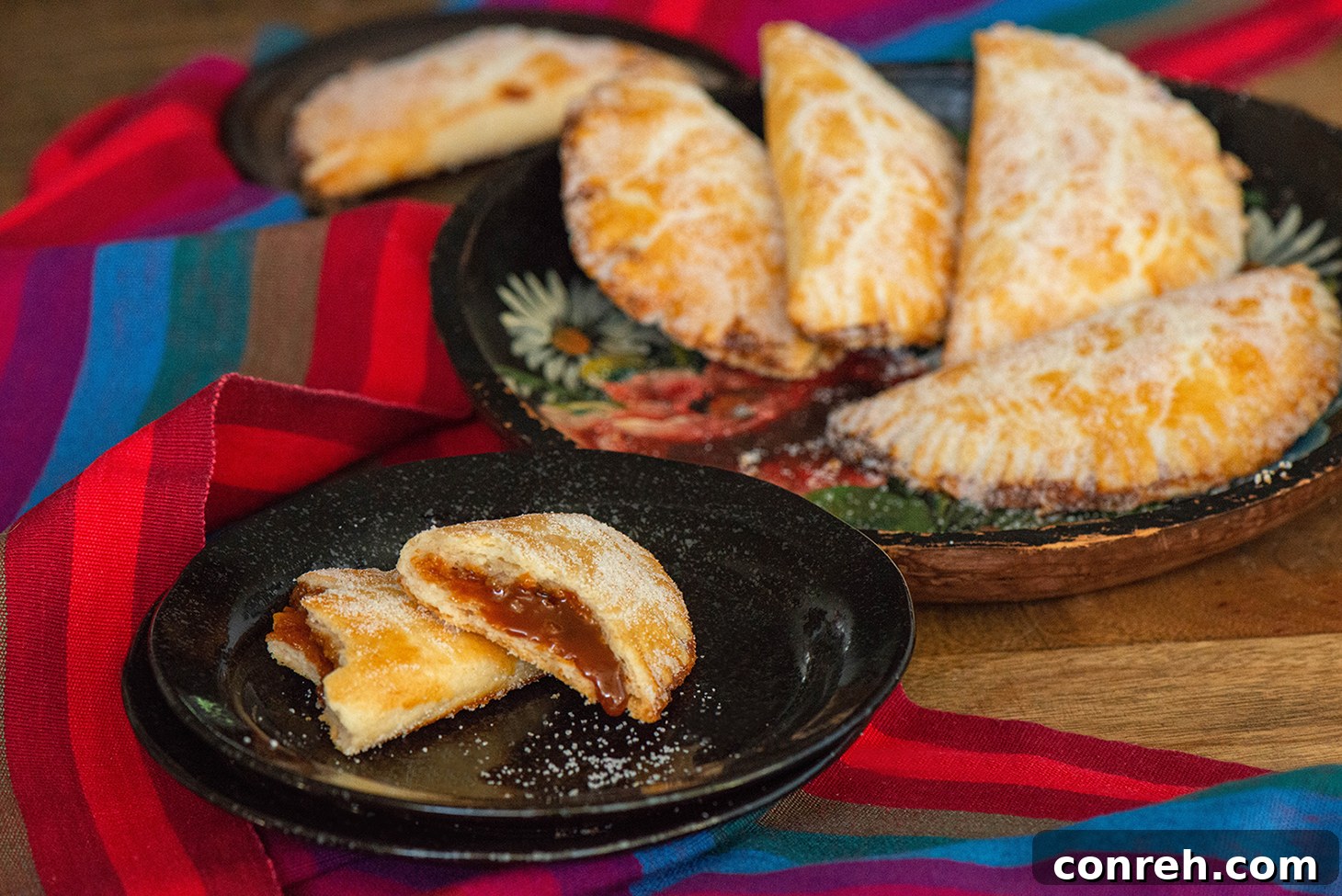 Decadent Dulce de Leche Pastries 3 A close-up shot of Dulce de Leche Empanadas, showcasing their golden crust and crimped edges.