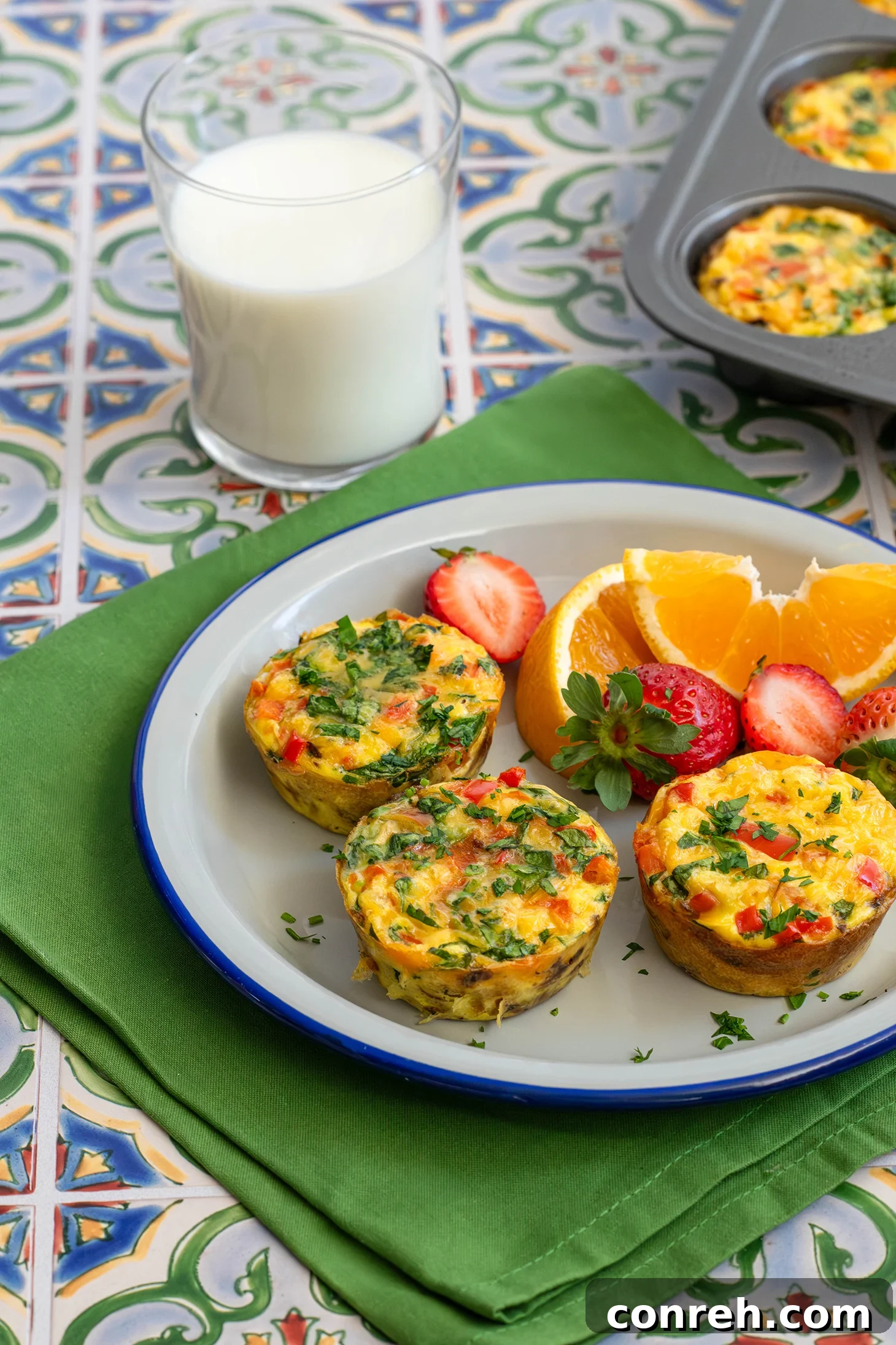 Breakfast Hashbrown Nests with vibrant colors, served in a muffin tin.