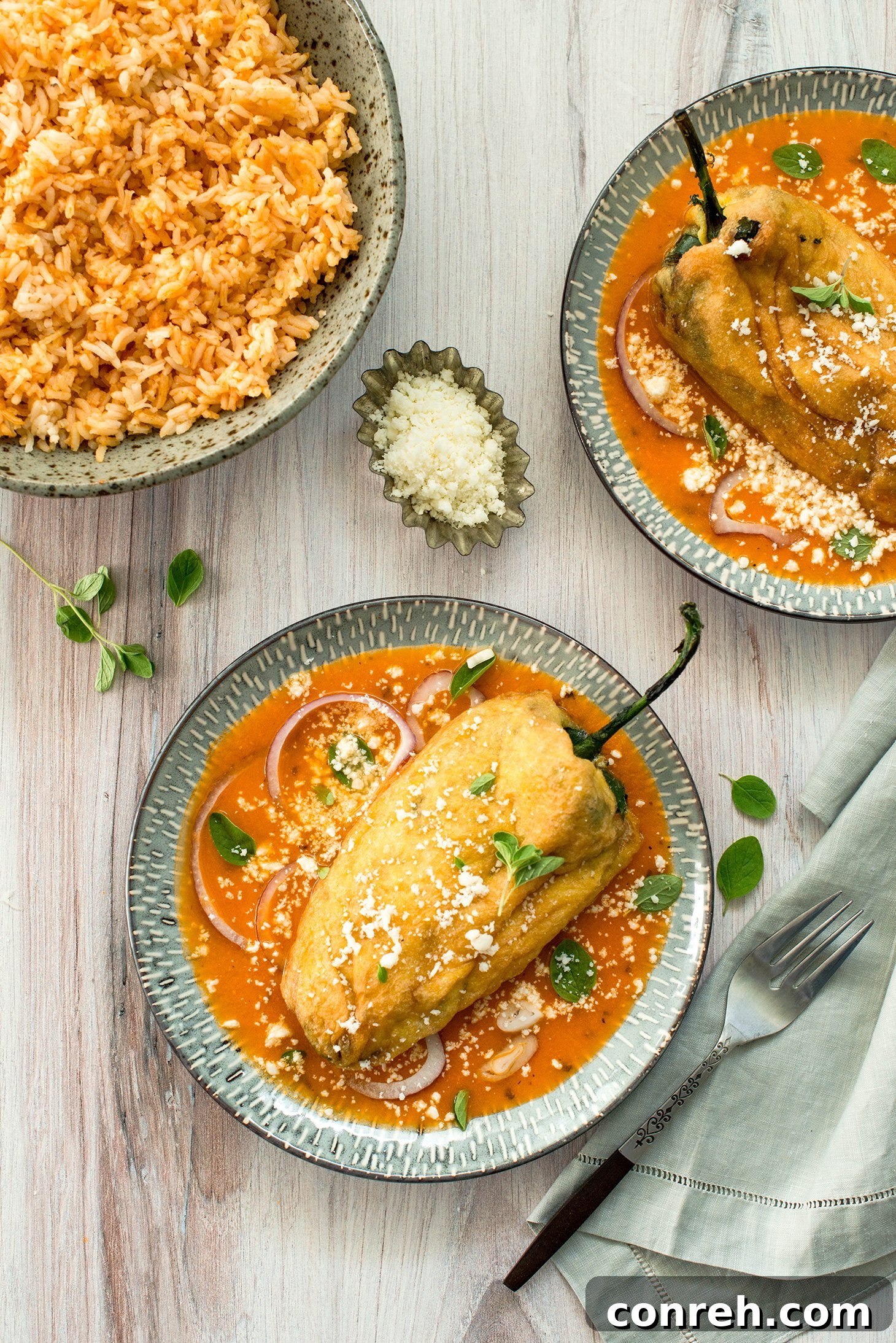 Traditional Chiles Rellenos served with tomato sauce