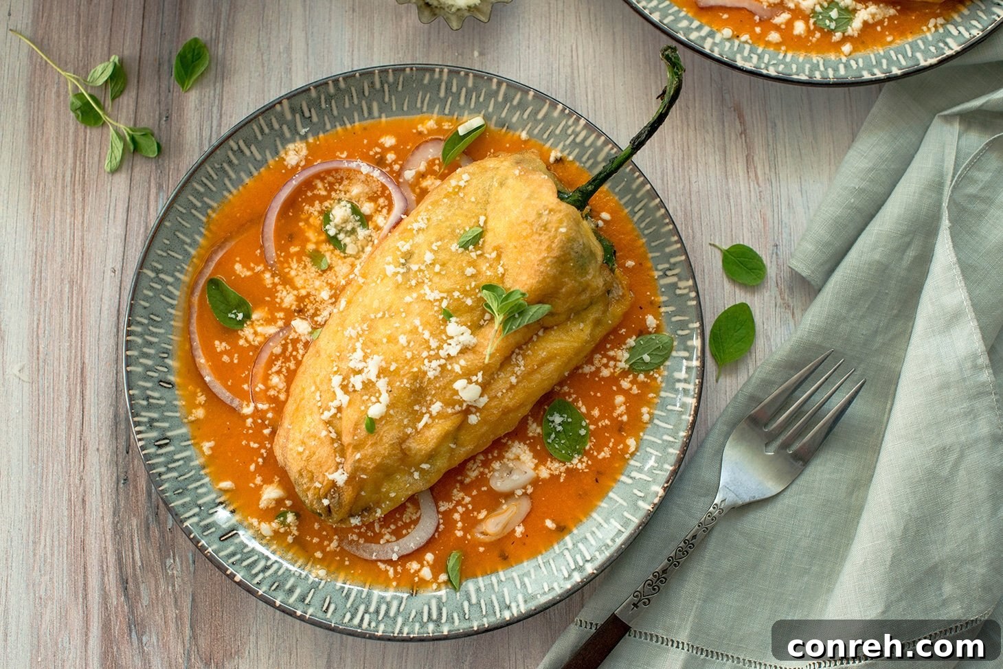 Close-up of perfectly fried Chiles Rellenos ready to be served
