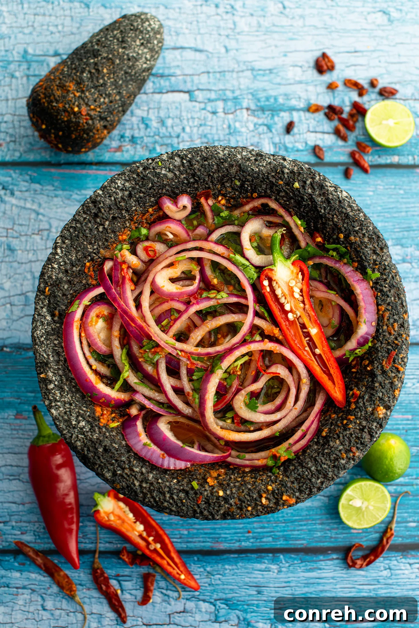 Chile Piquín Pickled Red Onions 2 Vibrant red pickled onions infused with chile piquín, ready to elevate any dish