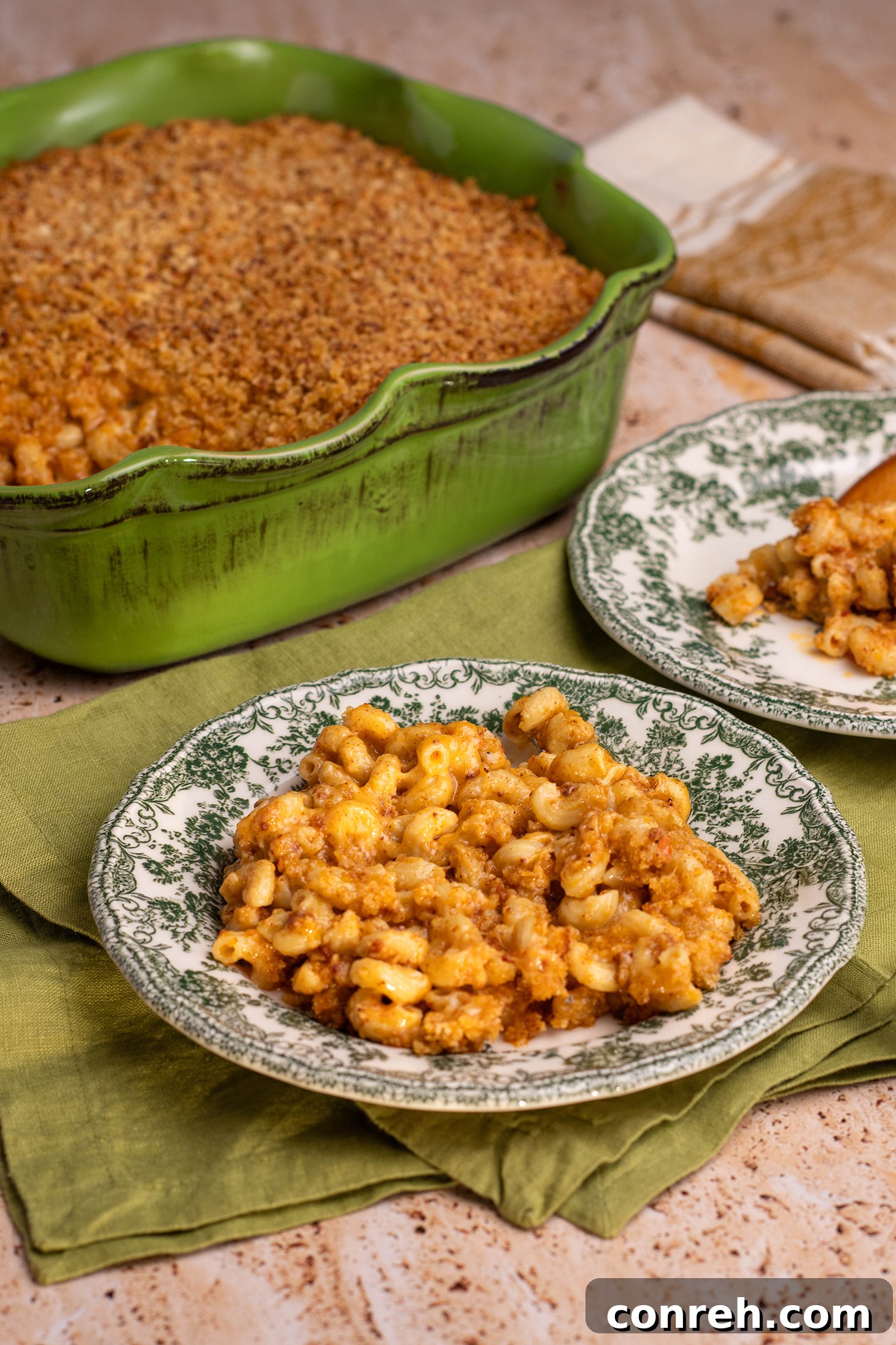 A serving of Mexican Mac and Cheese with Chorizo on a plate, showing its cheesy, textured layers.