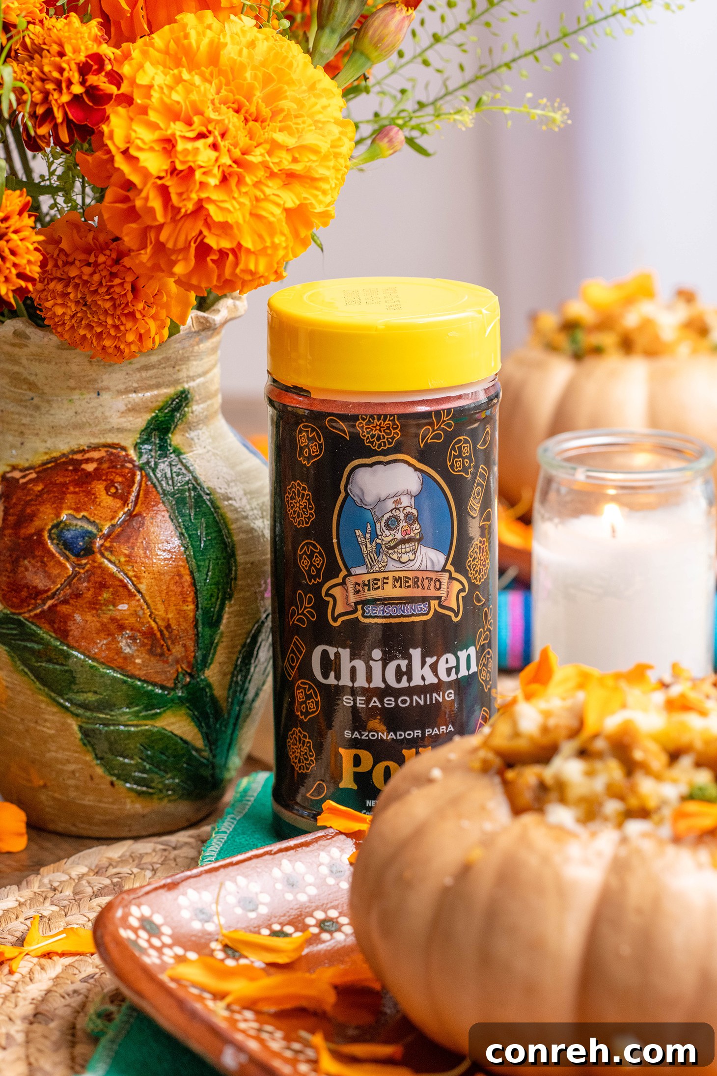 Arroz con Pollo Roasted Pumpkins displayed in a row, with marigolds.