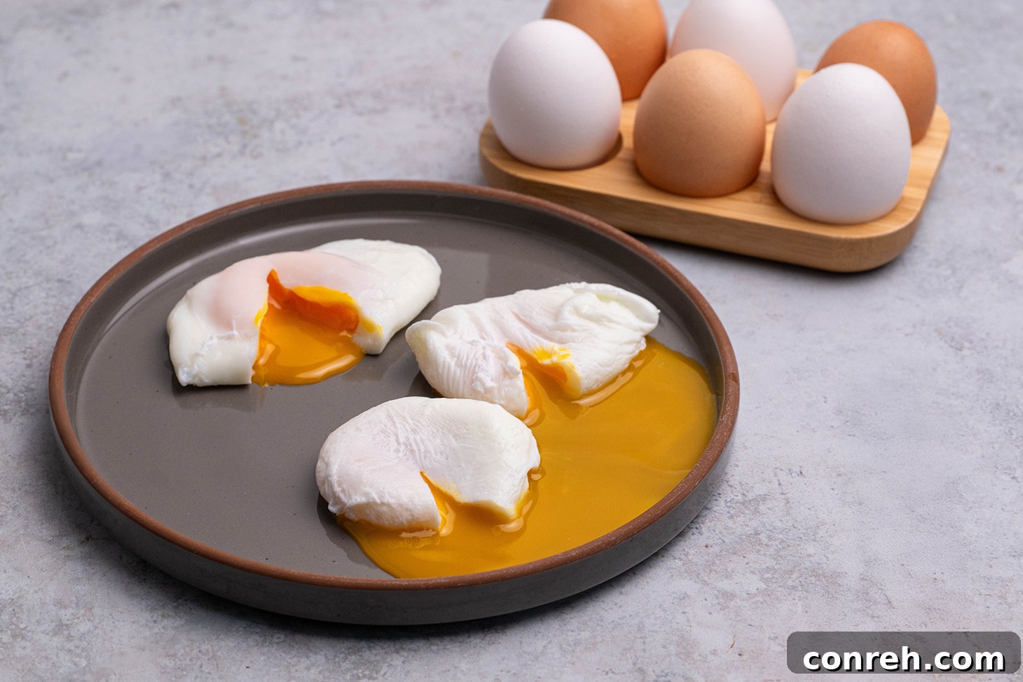 A beautifully poached egg served on a plate, ready to be enjoyed.