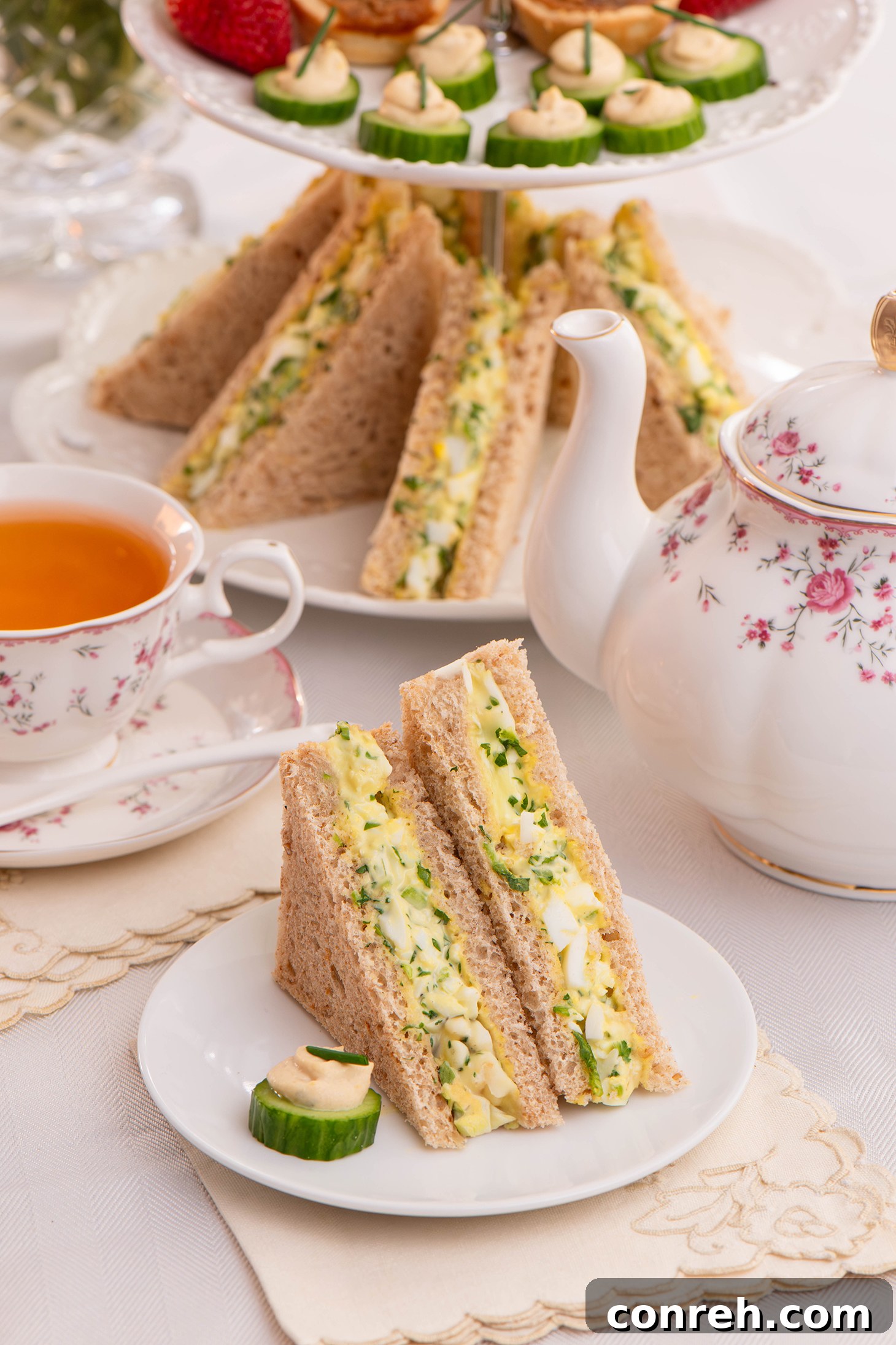 A close-up of a freshly made Egg and Watercress Sandwich, showing the vibrant green filling.