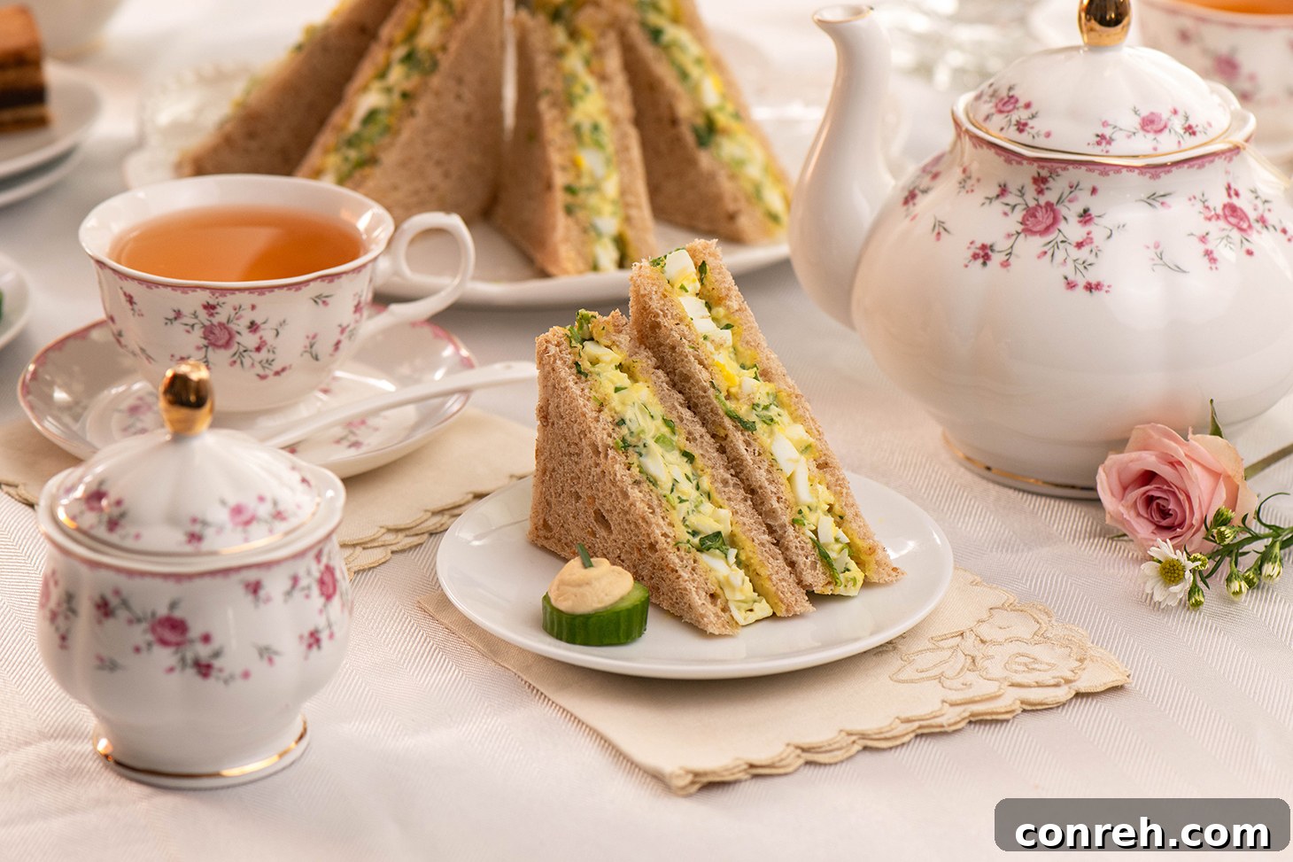 A display of Egg and Watercress Sandwiches cut into triangles, ready for serving.