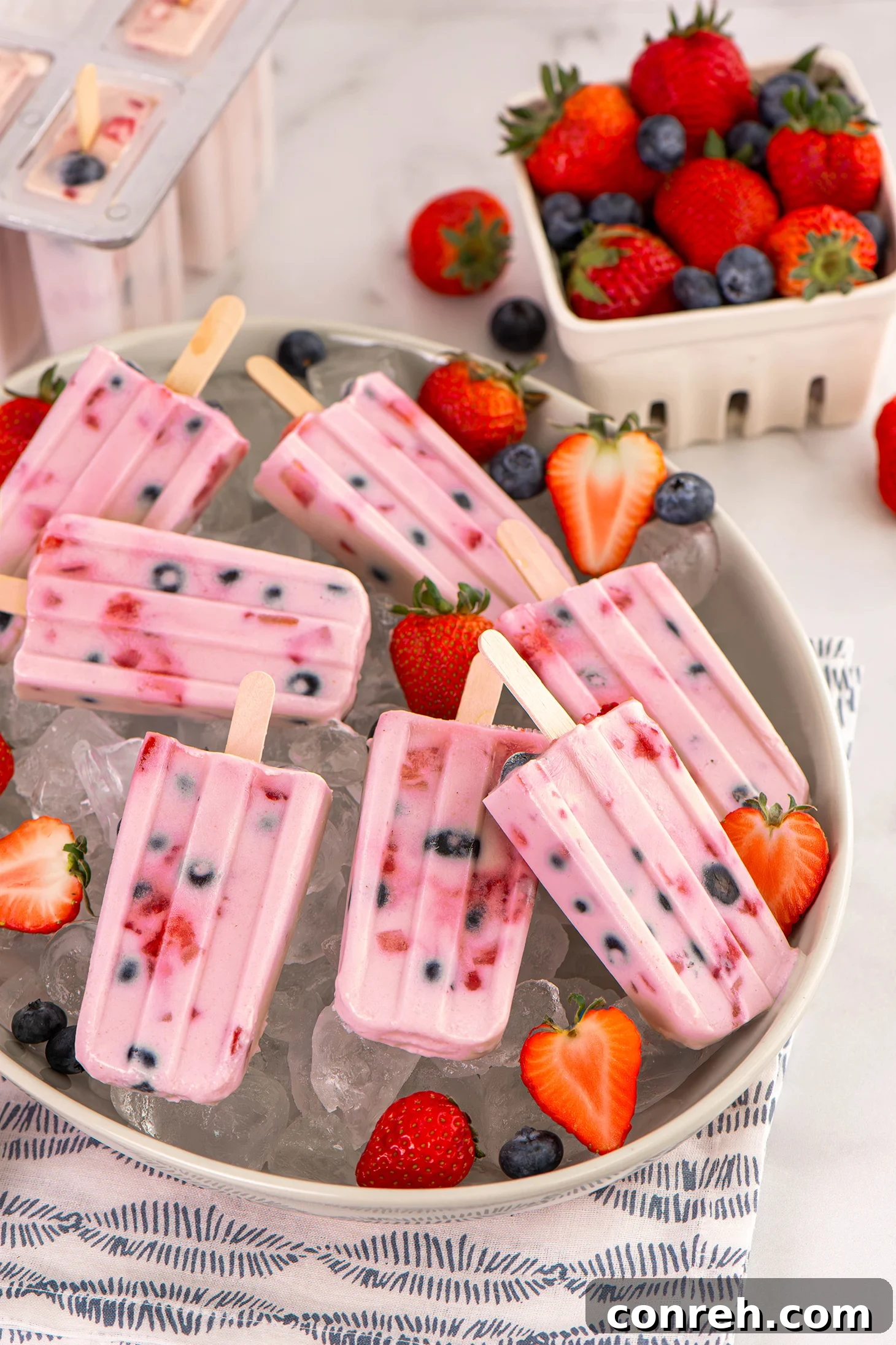 Creamy Strawberry Custard Paletas with Fresh Berry Swirls, an irresistible frozen treat for summer.