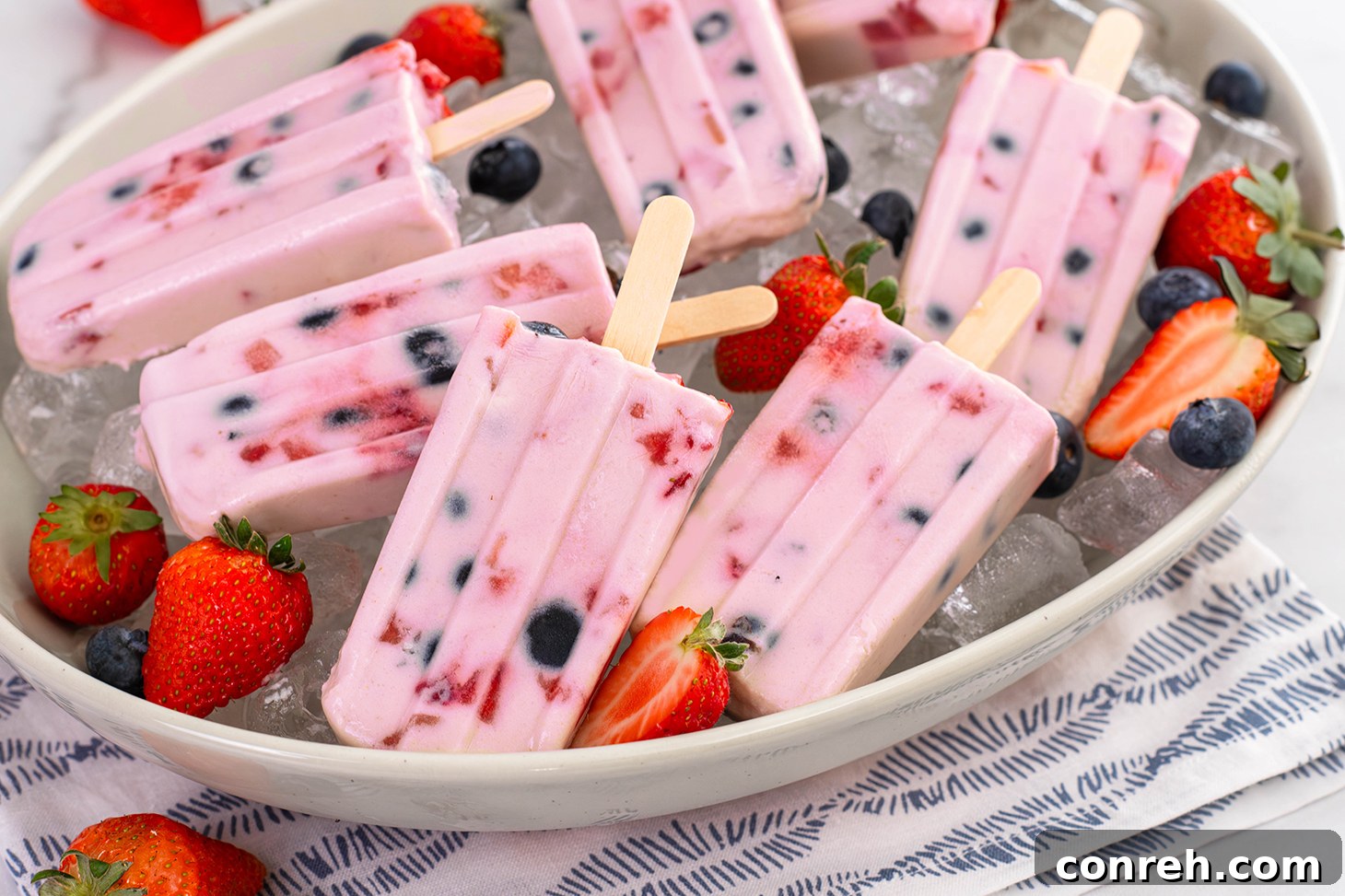 Close-up of Berry Custard Paletas showcasing the creamy texture and berry swirls.