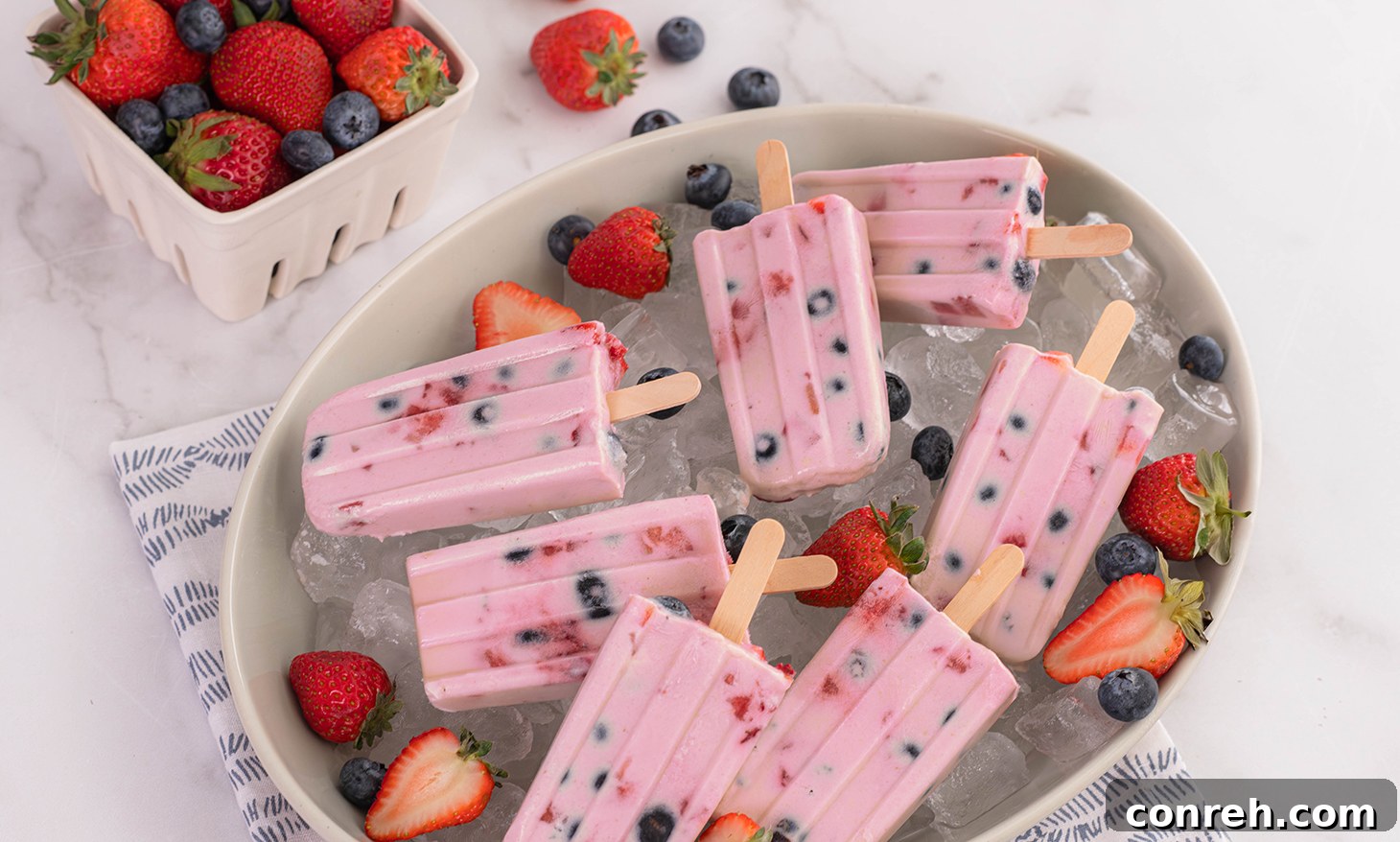 Neatly stored Berry Custard Paletas in a freezer-safe bag.